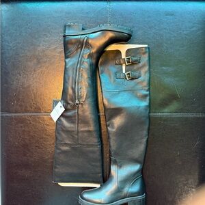 Zara black leather over-the-knee boots with a low lug sole Zipper and buckles.